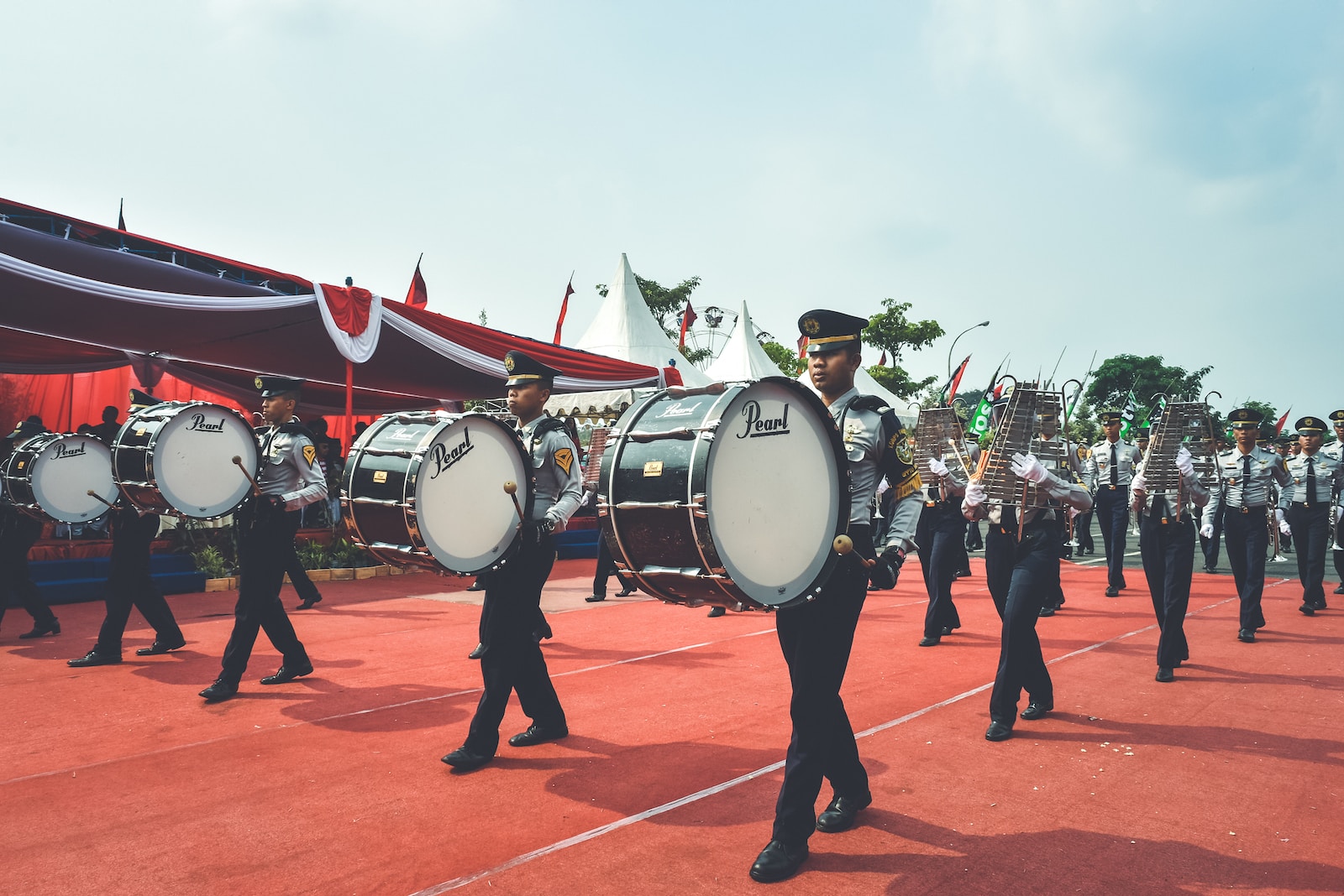 people playing drum on orange concrete floor during daytime